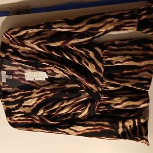 Women's v neck long sleeved blouse with bell sleeves at the bottom